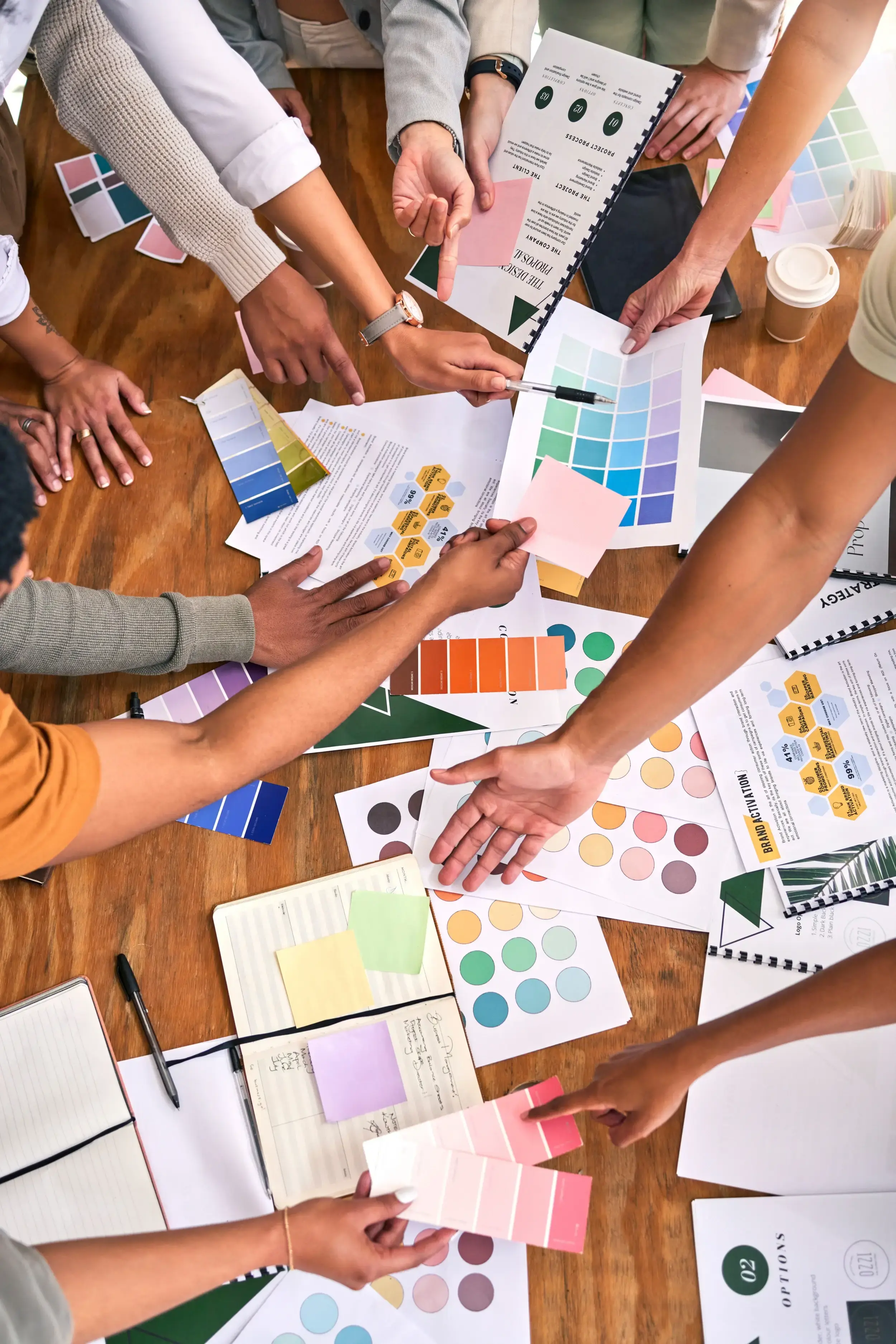 color-design-palette-hands-business-people-desk-branding-meeting-strategy-marketing-teamwork-paper-top-view-designers-brainstorming-ideas-thinking-creative-project