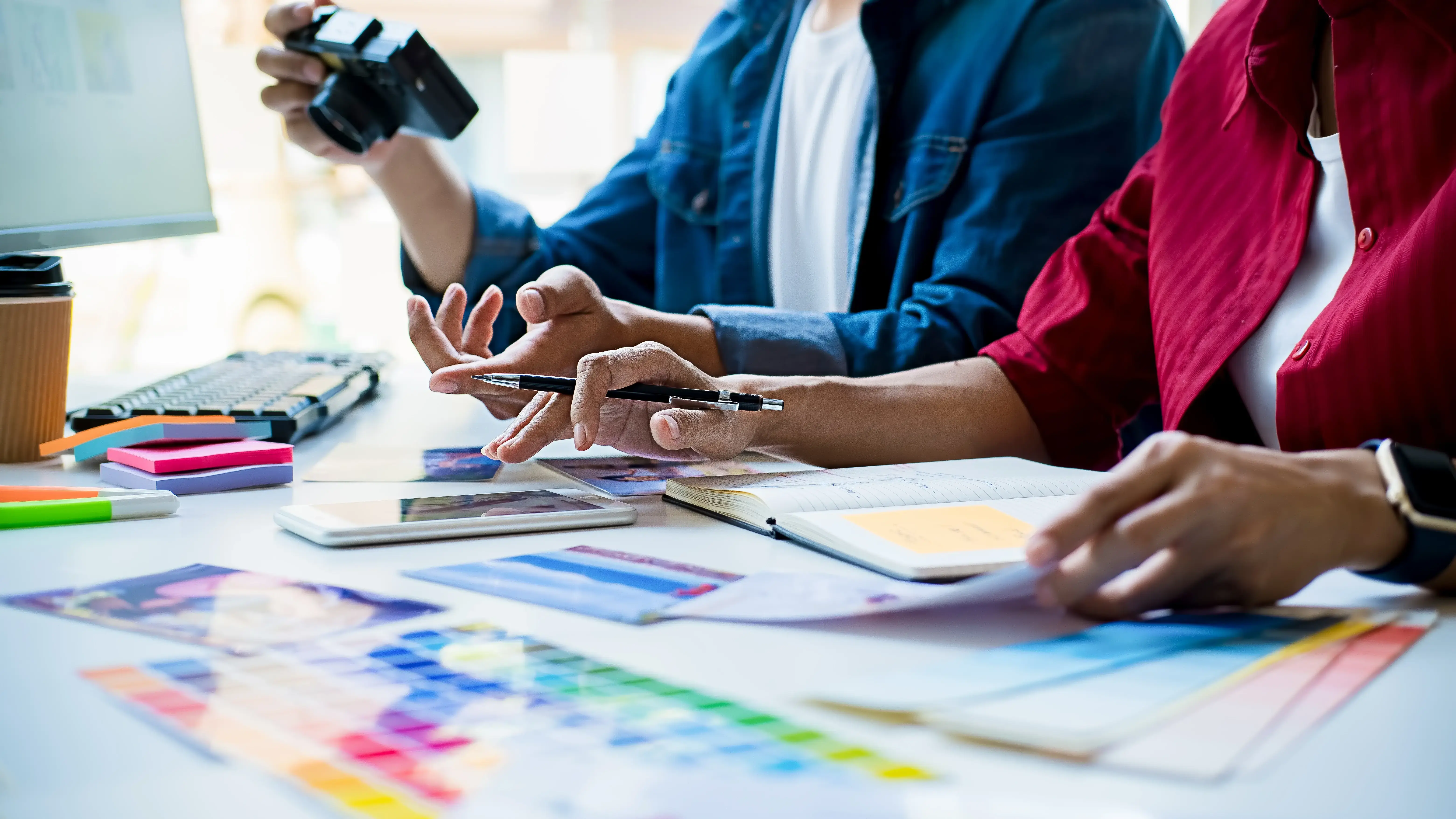 midsection-woman-man-working-table